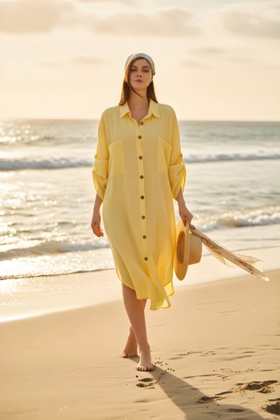 فستان قميص واسع أصفر من الموسلين بأكمام خفاش وجيوب